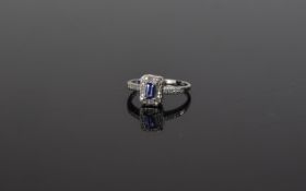 9ct Gold Diamond Dress Ring, central tanzanite surrounded by round cut diamonds.