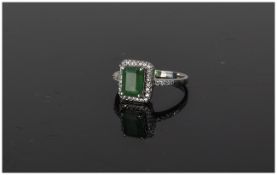 Ladies 9ct White Gold Set Emerald and Diamond Ring. The Central Emerald Surrounded by 24 Diamonds.