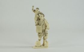 Japanese - Fine and Late 19th Century Carved Ivory Figure of a Street Vendor with a Small Boy