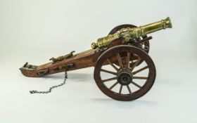 Good Quality Vintage Replica British Artillery Brass Cannon, features metal trimmed rotating wheels,