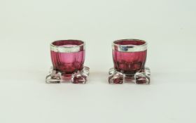 Victorian Pair of Silver Banded Cranberry Glass Mustard Cups. Each Standing on Four Square Feet.