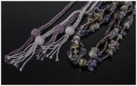 Long Amethyst Nugget and Glass Necklace plus two lariat necklaces, the amethyst necklace