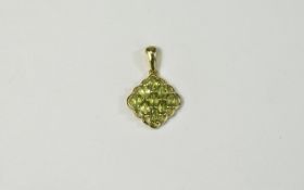 Peridot Pendant, nine oval cut peridots, set in a lozenge shape, with an openwork,