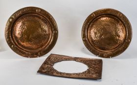 Two Copper Circular Chargers, embossed planished form.