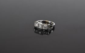 18 Carat White Gold Three Stone Diamond Ring set with three round modern brilliant cut diamonds.