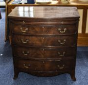 George III Mahogany Bow Fronted Chest Of Drawers Standing On Four Splayed Legs With Original Brass
