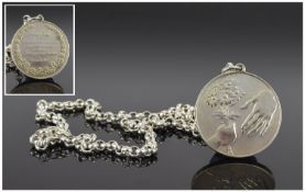A Silver Peace Medallion Attached to a Silver Belcher Chain. Fully Hallmarked. 22 Inches In