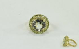 Green Amethyst and Peridot Ring, an 11ct round cut green amethyst framed by 1.