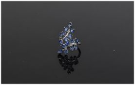 Sapphire 'Leaves' Crossover Ring, two branches filled with 3.