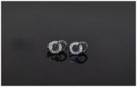 9ct White Gold Stud Earrings interlocking rings set with black and white diamonds.