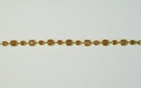 Peach Moonstone Line Bracelet, with cushion cuts of two alternating sizes totalling 16.75cts, set in