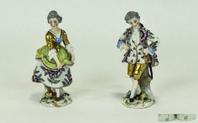 Chelsea Style Pair of Handpainted Porcelain Figures. Painted with gold anchor to each figure at