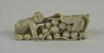 Japanese Late 19th Century Finely Carved Ivory Figure of a Man on His Knees, Covering over His Fruit