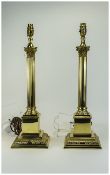 Pair Of Brass Corinthian Column Table Lamps Raised On Square Stepped Bases,