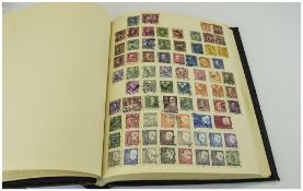 Black Spring Back Stamp Album, Well Stocked with Stamps From Around The World. Not Much