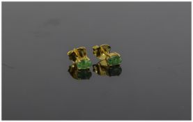 Emerald Pair of Stud Earrings, oval cut solitaire emeralds, totalling .5ct, set in 14ct vermeil