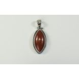 Red Jade Pendant, a 24ct marquise shape, cabochon cut, red jade stone, bezel set in silver with a