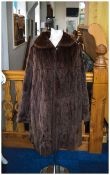 Red/Brown Ermine Coat, edge-to-edge style, one hook and loop to front of standing collar, slit