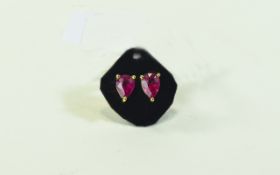 Ruby Solitaire Stud Earrings, each earring comprising a pear cut, rich red, ruby of approximately