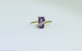 9ct Gold Dress Ring set with an emerald cut amethyst and a row of round cut diamonds,