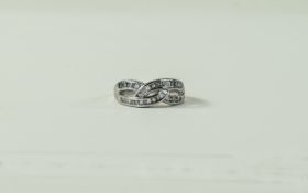 18ct White Gold Criss Cross Baguette and Brilliant Cut Diamond Set Ring.