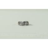 18ct White Gold Criss Cross Baguette and Brilliant Cut Diamond Set Ring.