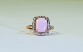 Pink Opal Solitaire Ring, an elongated cushion cut cabochon pink opal of 3cts, set in rose gold