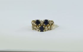 14ct Gold Diamond and Sapphire Cluster Ring set with round brilliant cut diamonds and oval set