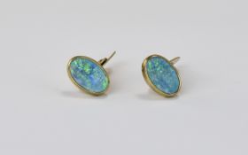 A Good Pair of 9ct Yellow Gold Set Cufflinks, Set with Oval Shaped Quality Opals, Marked 9ct. 8.