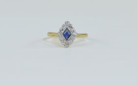 18ct Art Deco Diamond and Sapphire Ring central sapphire surrounded by 12 round cut diamonds.