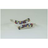 Multi Gemstone Crossover Bangle, set with fire opal, amethyst, sky blue topaz, peridot, rhodolite