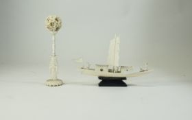 An Early 20th Century Small Carved Ivory Figural Stand with Puzzle Ball. 6.