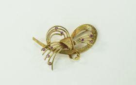 18ct Yellow Gold Stylish Brooch From The 1950's, Set with Rubies ( 9 ) In Total.