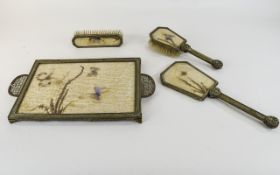 1930's Dressing Table Set gilt metal comprising tray, two brushes and hand mirror, the backs set