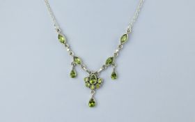 Silver Necklace, set with Peridot coloured stones.