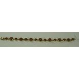 Peach Moonstone Line Bracelet, with cushion cuts of two alternating sizes totalling 16.75cts, set in