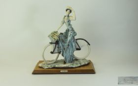 Capodimonte Signed Figure ' Victorian Lady on a Bike ' Signed A. Belcari. Raised on a Wooden Base.