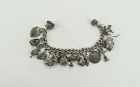 A Vintage Silver Bracelet Loaded with 17 Charms. All Fully Hallmarked. 72.