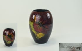 Moorcroft Flambe Vase ' Hibiscus ' Design on Chocolate Ground. Stands 5.25 Inches High.