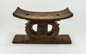 African Tribal Art Ashanti Carved wooden stool,bowed seat, ornate carved central openwork support