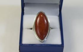 Red Jade Solitaire Ring, a marquise shape cabochon of 24cts in a simple silver bezel setting,