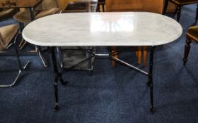 Conservatory Table With Marble Oval Top Tainted black metal base 28 inches high 24 inches deep 47
