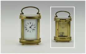 French 19th Century Quality and Shaped Brass Carriage Clock With Glass Panels. Visible Escapement