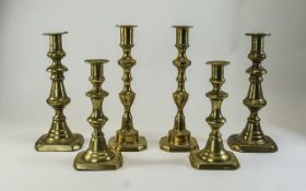 Three Sets Of 19thC Graduating Brass Candlesticks With Pushers,