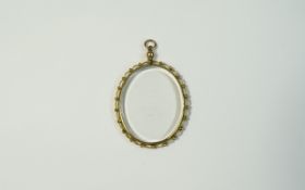 A Vintage 9ct Yellow Gold and Glass Oval Shaped Locket / Pendant with Ornate Border.