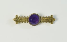 Victorian Bar Brooch, Central Amethyst Coloured Stone Set In A Yellow Metal Mount.