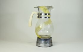 Mid 20thC Musical Decanter, Glass body With White & Yellow Enamelled Swirls, Chrome Fittings,