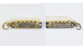 A Bespoke 9ct Gold Charm In The Form of a Miniature Harmonica which plays.