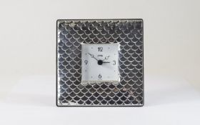 A Modern Silver Table Clock with Overlapping Shell Design to Front, Mahogany Back, Chrome