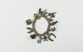 A Vintage and Antique Charm Silver Bracelet,
